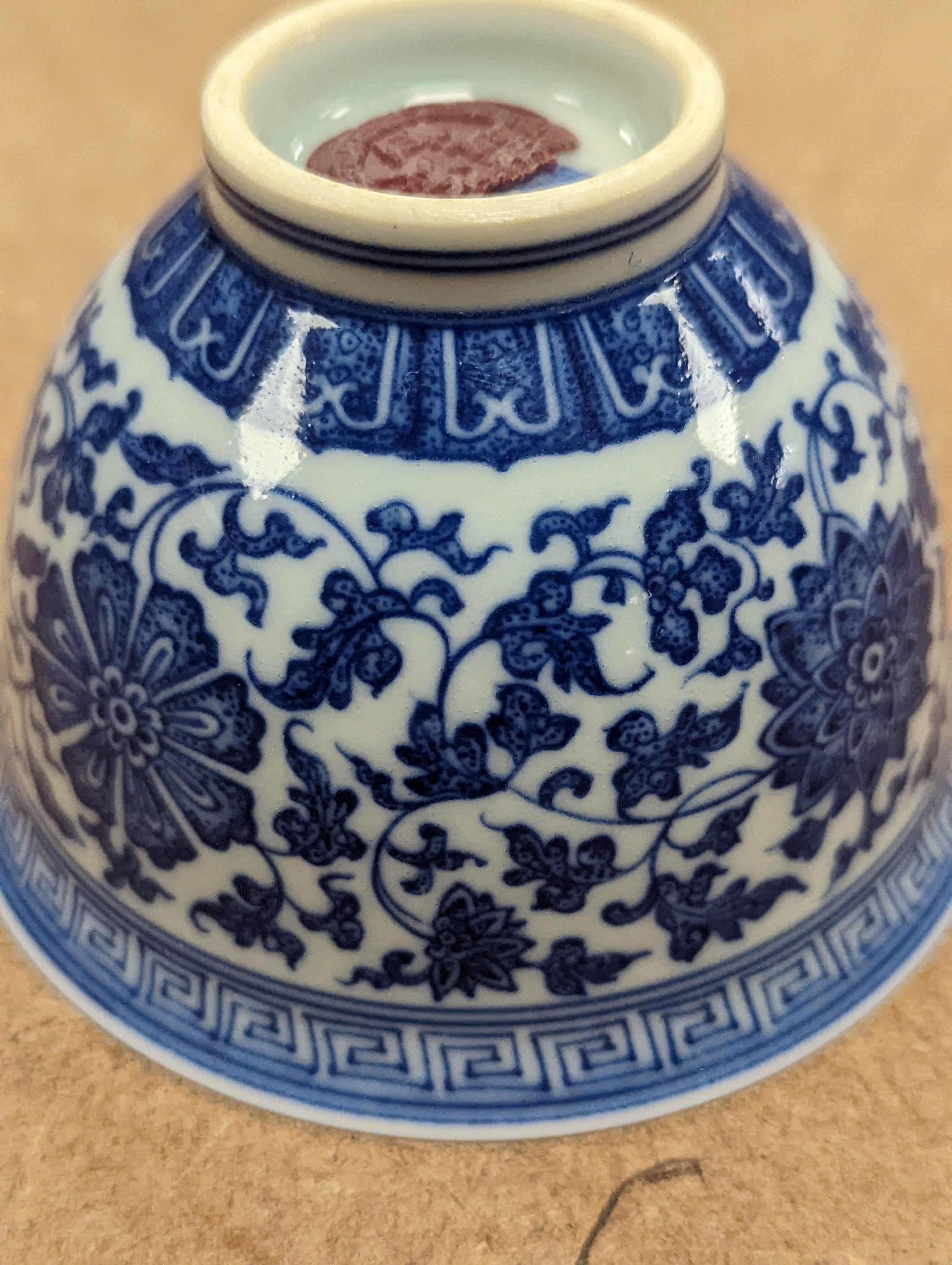 A Chinese blue and white 'lotus' cup. 9cm diameter